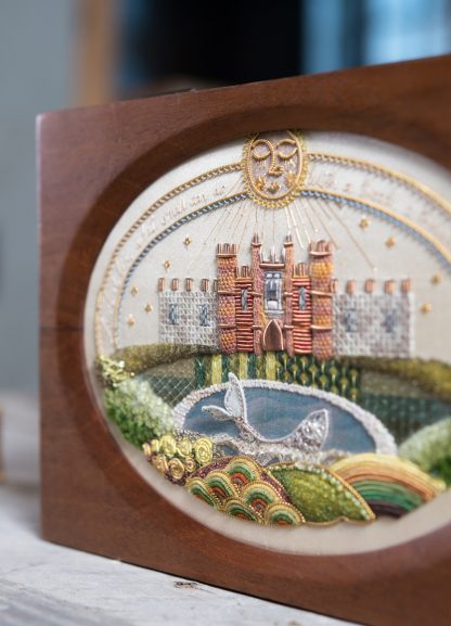 Hampton Court Sampler, in wooden casket with an oval aperture close up detail